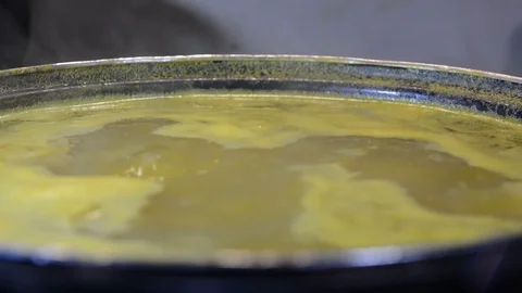 Close up view soup boils in a pan	 Stock Footage 120415419
