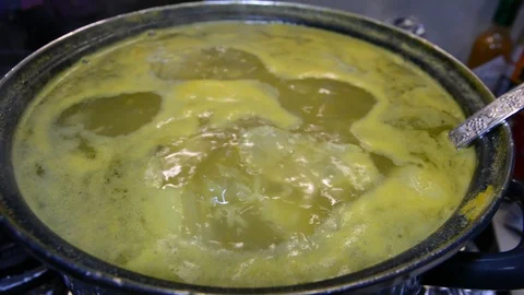 Close up view soup boils in a pan	 動画素材 120415559