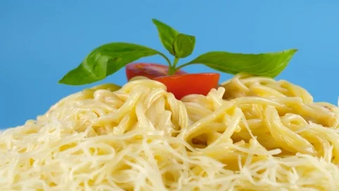 Close-up view of spaghetti with cheese, blue background ready for chroma key Stock Footage 78664390
