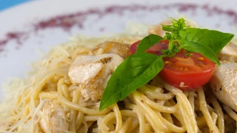 Close-up view of spaghetti with grilled chicken and cheese Stock Footage 78667469