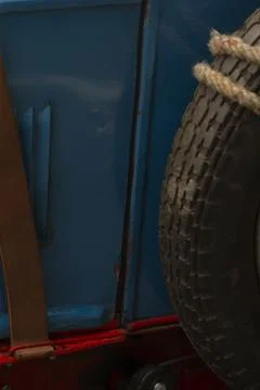Close view of spare tire mounted inside blue utility vehicle Stock Photos