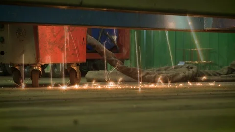 Close-up view of sparks falling on the floor during welding. Stock Footage 126219367