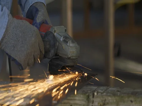 Close view of sparks showering from angle grinder metal in slow motion 4K Stock Footage 80404100