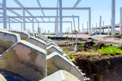 Close up view on spikes of road roller for compacting soil at construction si Stock Photos