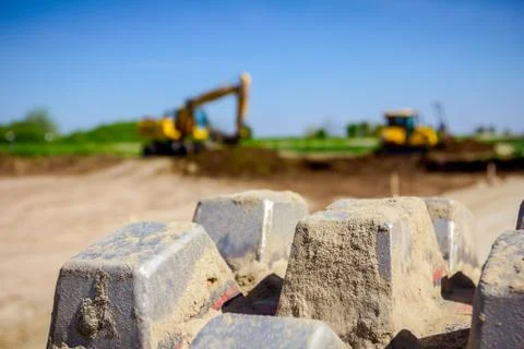 Close up view on spikes of road roller for compacting soil at construction si Stock Photos