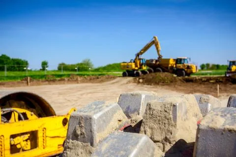 Close up view on spikes of road roller for compacting soil at construction si Stock Photos