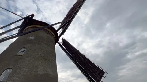 Close up view of spinning Dutch windmill wooden blades. Kinderdijk, Netherlands Stock Footage 219257376