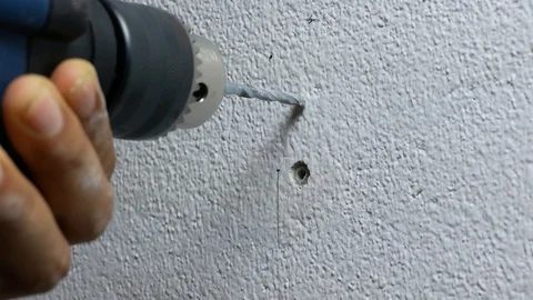 Close-up View of Spinning Metal Spiral electric Drill Bit on the concrete cem Stock Footage 89730692