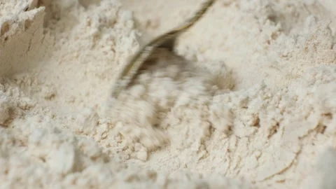 Close up view of spoon scooping and mixing spelt wheat flour Stock Footage 346760223
