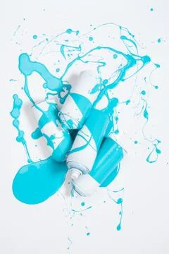 Close up view of spray paint in cans covered with blue paint isolated on whit Fotos de archivo