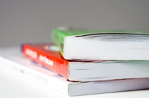 Close-up view of   stack  of  books  on the  table  . Reading at home in your Stock Photos