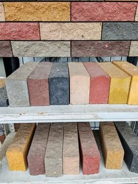 Close up view of a stack of bricks displaying various shades of red and gray. 写真素材