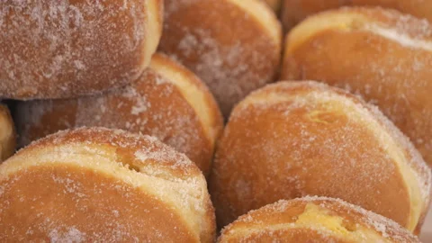 A close up view of a stack of sugar donuts. Stock Footage 111140781
