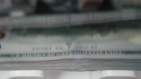 Close-up view of stacked banknotes showing gradual transition from blurred to Stock Footage 331080007