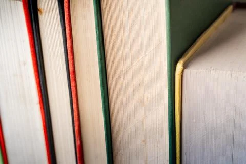 A close-up view of stacked educational books highlighting their colorful spines Stock Photos