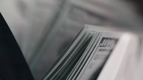 Close-up view of stacked hundred-dollar bills in a wallet, showcasing the Stock Footage 331080232