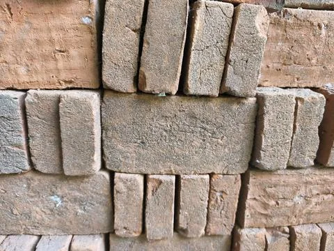 Close-up View of Stacked Rustic Red Clay Bricks for Construction Stock Photos
