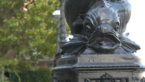 A close-up view of a statue of a fish on a street lamp. Stock Footage 141455594