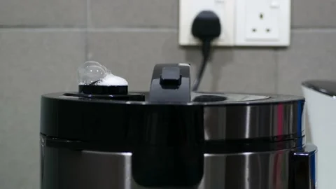 Close-up view of the steam and boiling from the rice cooker 動画素材 196266483