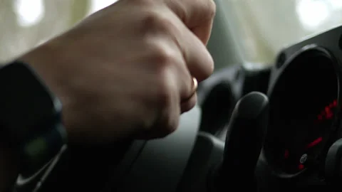 Close up view of steering wheel that man is holding and driving in mountains and Stock Footage 172556434
