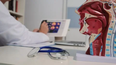 Close up view of stethoscope with books on table and female doctor Stock Footage 251942206