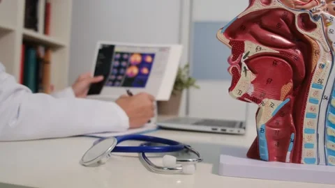 Close up view of stethoscope with books on table and female doctor Stock Footage 251942208