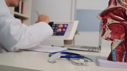Close up view of stethoscope with books on table and female doctor Stock Footage 251942212