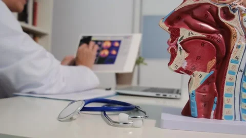 Close up view of stethoscope with books on table and female doctor Stock Footage 251942213