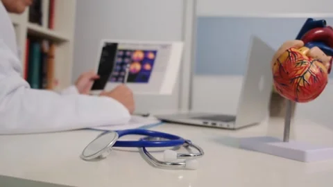 Close up view of stethoscope with books on table and female doctor Stock Footage 251942235