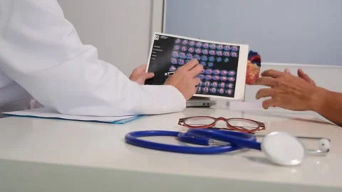 Close up view of stethoscope with books on table and female doctor Stock Footage 251942270