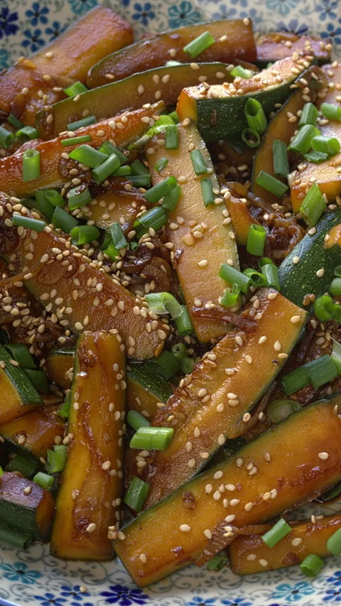 Close-up view of stir-fried zucchini. Vertical video. Video stock 312610031