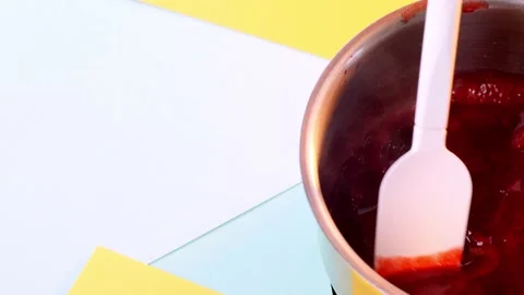 Close-up view on stirring boiling red syrup sauce Video stock 151120669