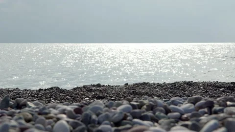 Close up view of the stone beach in autumn. View of the sea in cloudy weather on Stock Footage 224180475