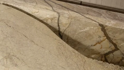 Close up view of stone surface likely marble or granite with visible veins and Stock Footage 295551504