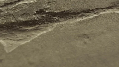 Close view of a stone surface with rough texture in natural lighting Stock Footage 339460406