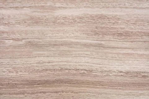 Close view of a stone surface showing layers and natural patterns in neutra.. 写真素材