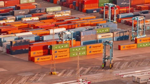 Close up view of straddle carrier trucks transferring shipping containers Stock Footage 155286956