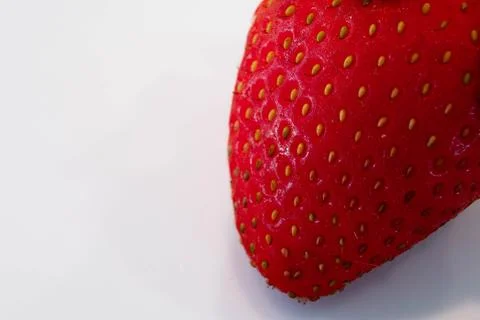 Close view of strawberry with tiny thread and moist skin Stock Photos