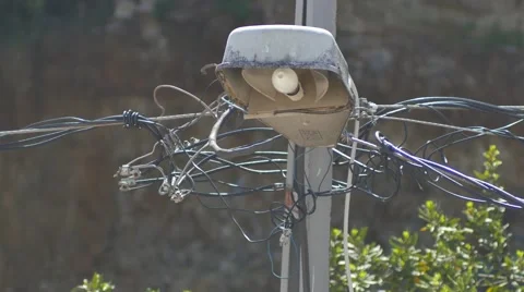 Close up view of a street lamppost. Complex maze of high voltage wires Stock Footage 49892539