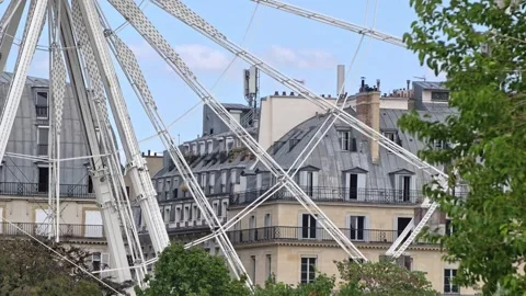 Close Up View Of The Structure And Spokes Of The Ferris Wheel Against Historic Stock Footage 343043969