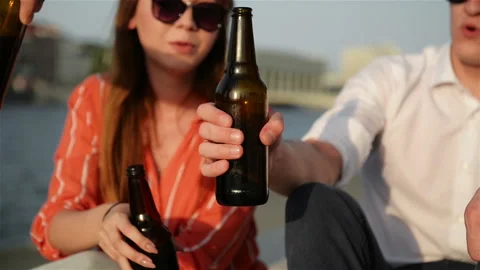 Close Up View Of Students Clinking Bottles With a Craft Beer. Young People Stock Footage 111771987