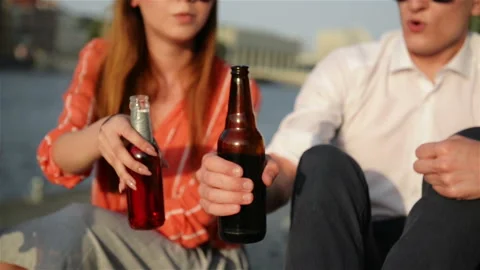 Close Up View Of Students Clinking Bottles With a Craft Beer. Young People Stock Footage 111772567