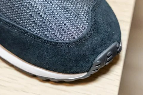 A close-up view of a stylish sneaker showcasing its detailed texture and design. Fotos de archivo