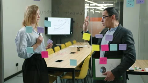 Close-up view of successful entrepreneurs preparing new financial report Stock Footage 236457863