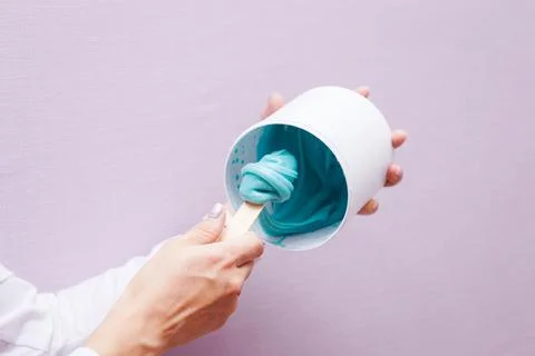 Close up view of sugar depilation paste mixing, blending, sugar paste on spatula Stock Photos