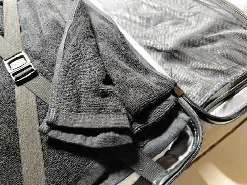 Close-up view of a suitcase interior organized with soft towels  Stock Photos