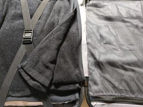 Close-up view of a suitcase interior organized with soft towels  Stock Photos