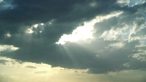 Close-up View of Sun Rays breaking throw Stormy Clouds Stock Footage 115668097