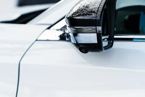 Close up view of surround view camera system on modern car side rear mirror.  Stock Photos
