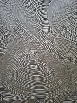 Close up view of swirl texture on a decorative surface featuring circular b.. 스톡 사진